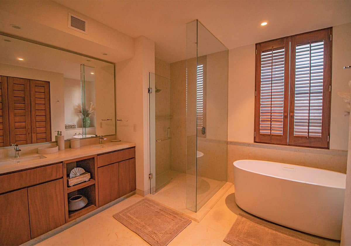 Designer master bathroom with split shower and bathtub