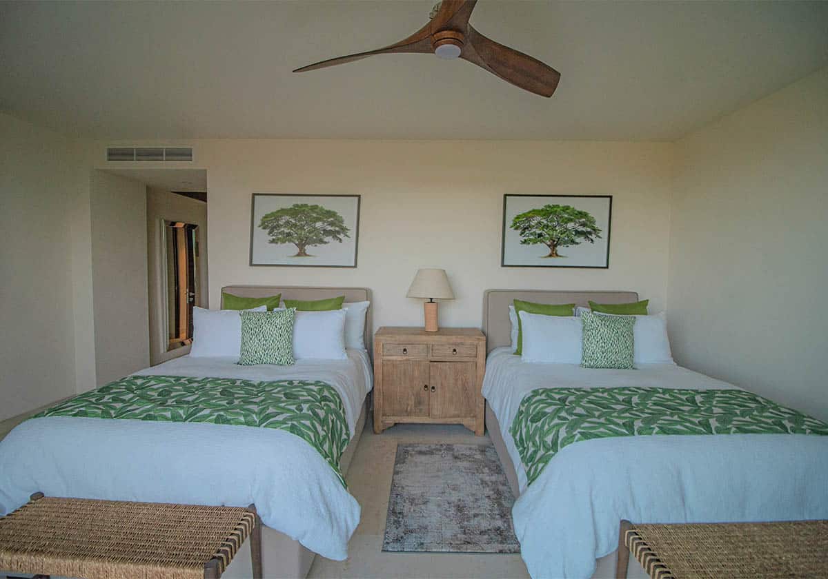 Bedroom having two beds with nature theme design