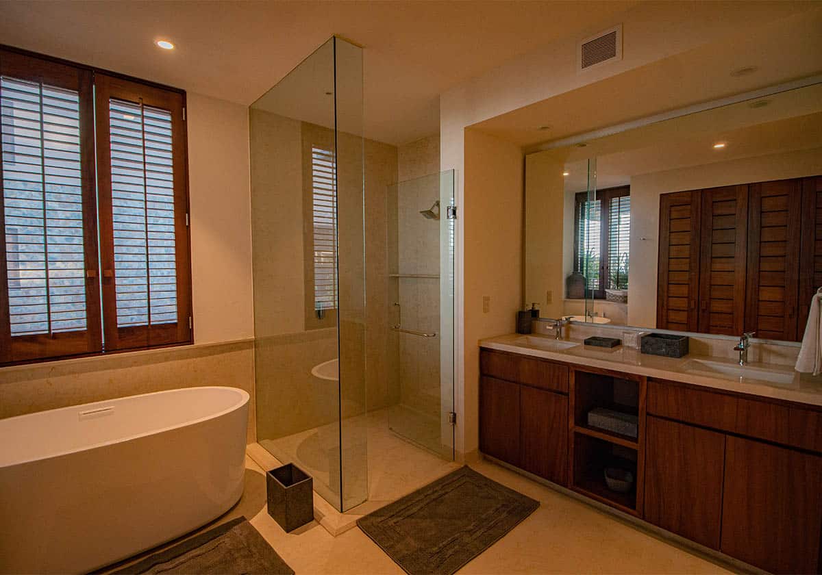 Designer master bathroom with split shower and bathtub